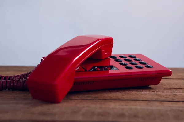 Telefone moderno na mesa de madeira — Fotografia de Stock