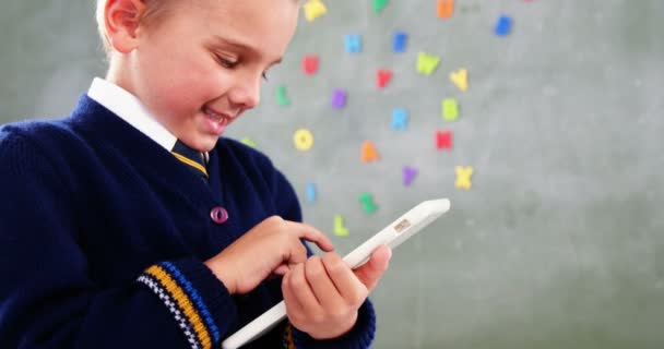 Schoolboy using Digital Tablet In Classroom — стоковое видео