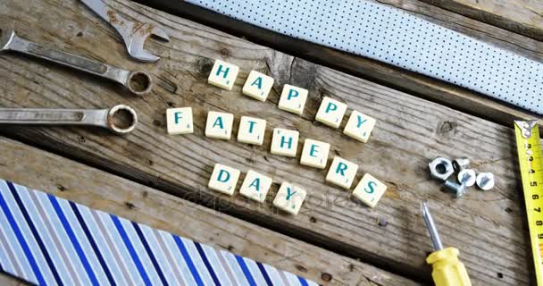 Happy fathers day block and old work tool arranged on wooden plank — Stock Video