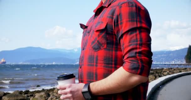 Man having coffee at seaside — Stock Video