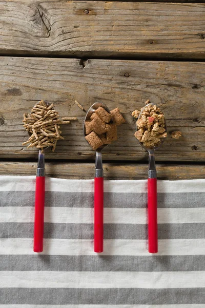 Tres cucharas con varios cereales para el desayuno — Foto de Stock