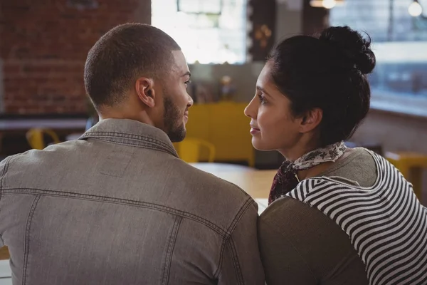 Couple looking each other at counter — Stock Photo, Image