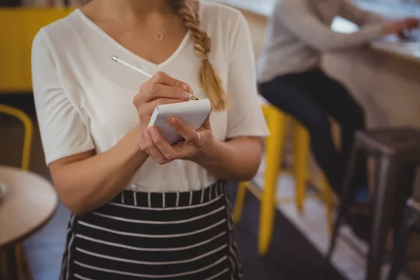 Mid section of waitress taking order — Stock Photo, Image