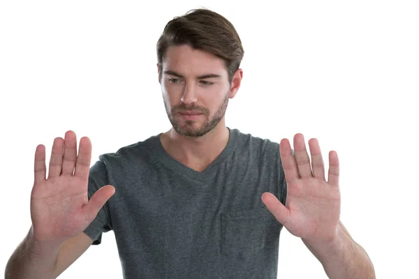 Man pretending to touch an invisible screen — Stock Photo, Image