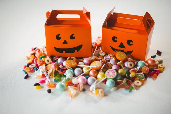 Orange boxes by various sweet food — Stock Photo, Image