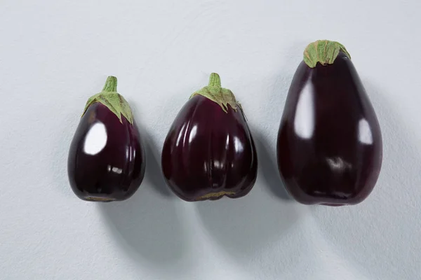 Eggplants arranged on a white background — Stock Photo, Image