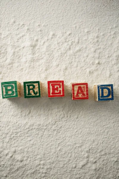 Texto de pão feito com blocos de farinha — Fotografia de Stock