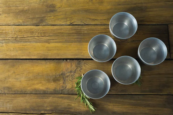 Plastic bowls and rosemary herb — Stock Photo, Image