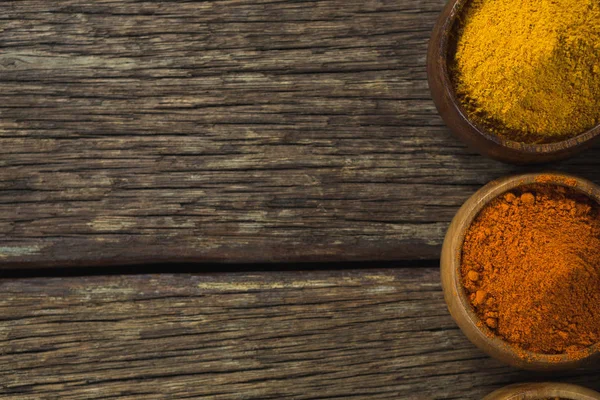 Spice powder on wooden table