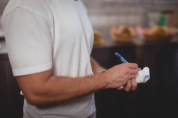 Buik van Ober schrijven op Kladblok — Stockfoto