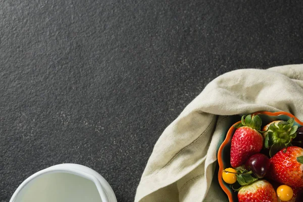 Bowl of fruits with milk and napkin — Stock Photo, Image