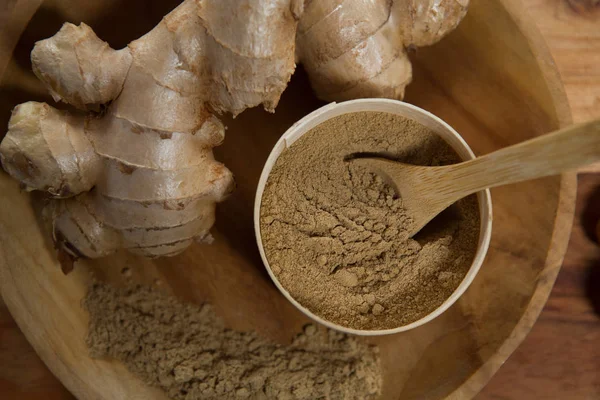 Ginger with powder in plate — Stock Photo, Image