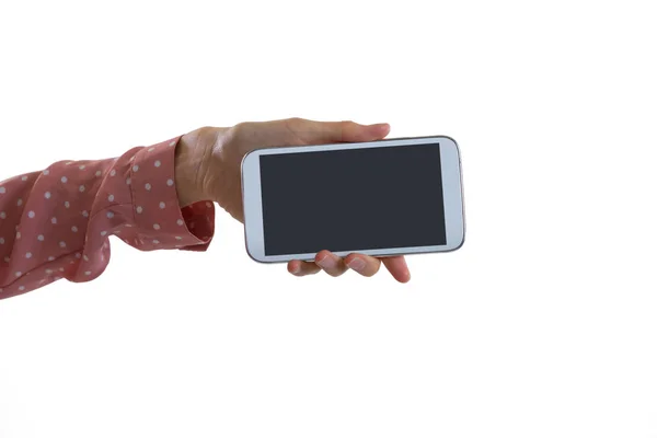 Mano de mujer mostrando teléfono móvil — Foto de Stock