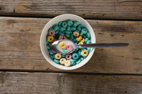 Bowl of froot loops with spoon — Stock Photo, Image