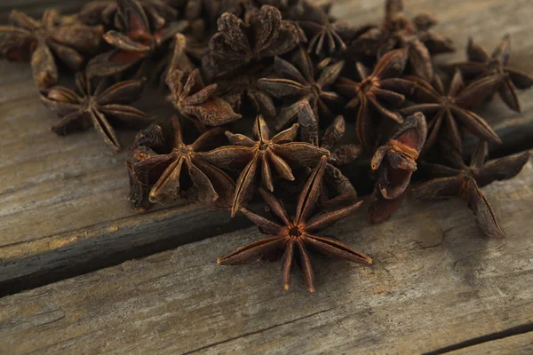 Star anises on wooden table — Stock Photo, Image