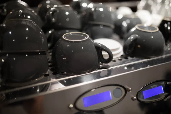 Coffee cups on coffee machine — Stock Photo, Image