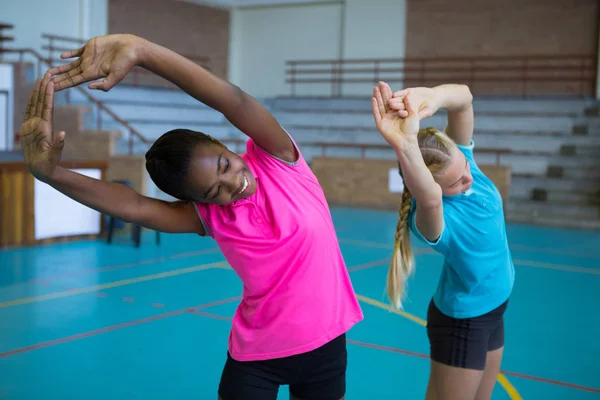 Volleyball players performing stretching — Stock Photo, Image