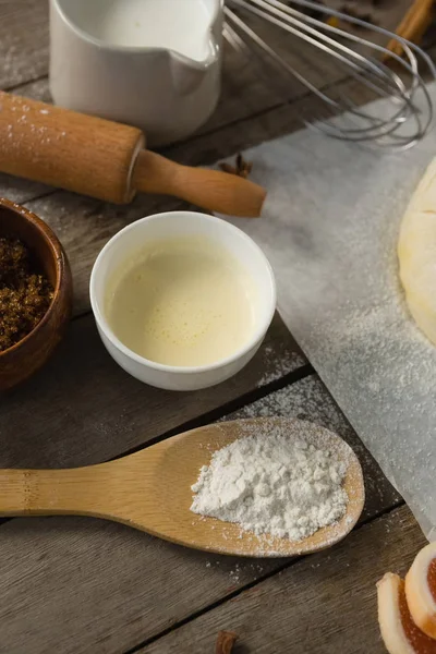 Close up of ingredients by kneaded dough — Stock Photo, Image