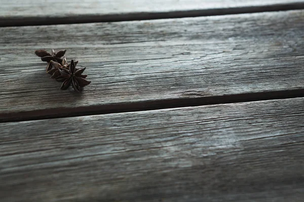 Star anises on wooden table — Stock Photo, Image