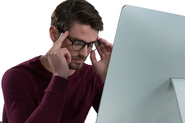 Stressed man sitting at desk — Stock Photo, Image