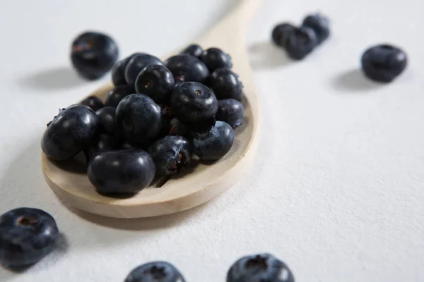 Blueberries arranged in a spoon on white background — Stock Photo, Image