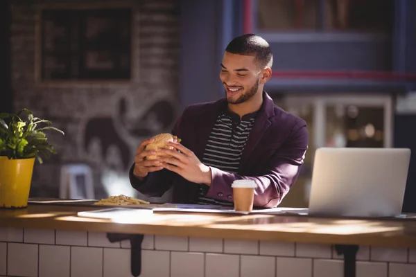 Professional holding fresh burger — Stock Photo, Image