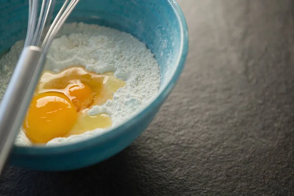 Flour and egg in container — Stock Photo, Image