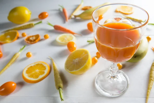 Orange juice with fruits on table — Stock Photo, Image