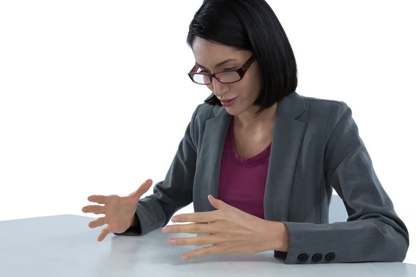 Businesswoman pretending to hold invisible object — Stock Photo, Image