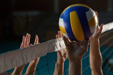 Cropped hands of players practicing volleyball clipart