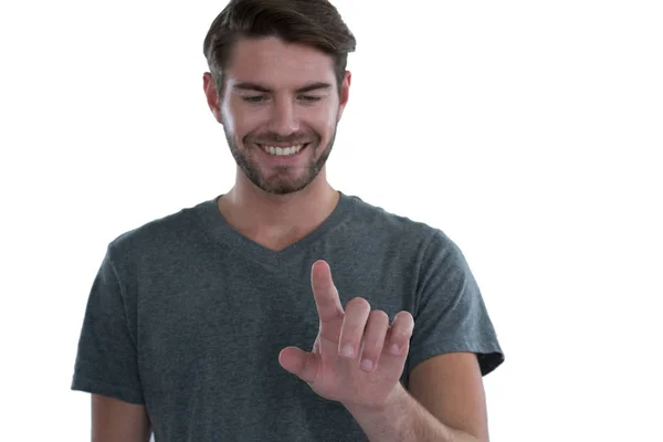 Hombre fingiendo tocar una pantalla invisible — Foto de Stock