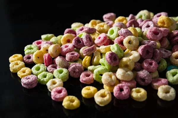 Froot loops on black background — Stock Photo, Image