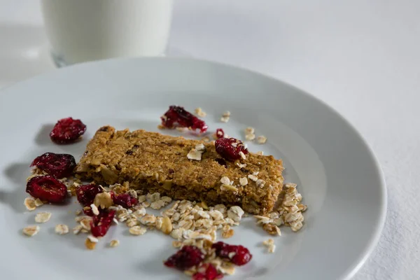 Granola bar in plate on white background — Stock Photo, Image