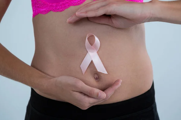 Woman with Breast Cancer Awareness ribbon — Stock Photo, Image