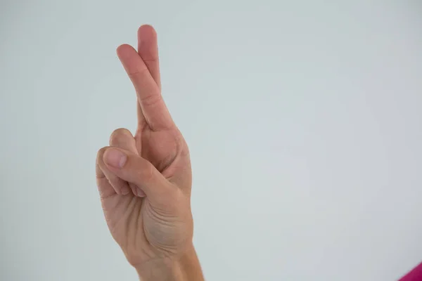 Hand of woman showing crossed fingers — Stock Photo, Image