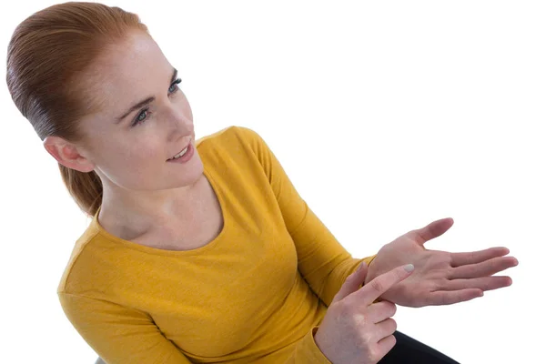 Businesswoman gesturing on imaginary product — Stock Photo, Image