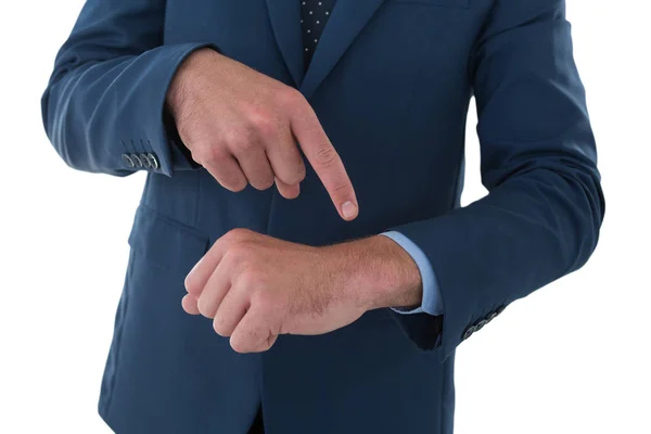 Businessman pointing on invisible wrist watch — Stock Photo, Image