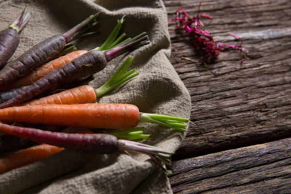 Fresh carrots on napkin — Stock Photo, Image