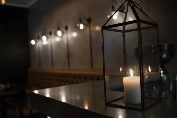 Close-up of lit candle on table — Stock Photo, Image