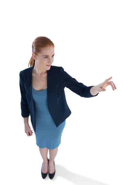 Businesswoman using imaginary interface — Stock Photo, Image