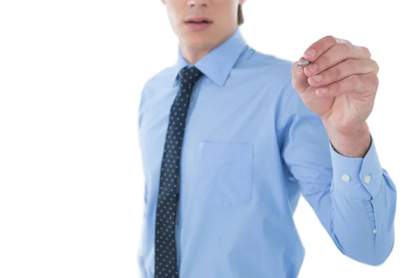 Businessman writing on imaginary screen — Stock Photo, Image