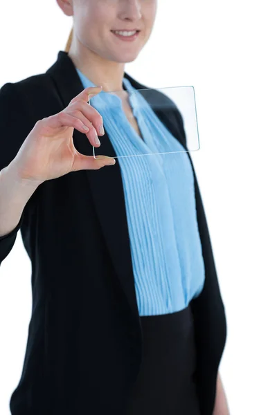 Бізнес-леді в костюмі, що показує скляний інтерфейс — стокове фото