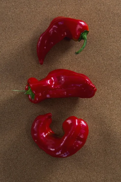 Red chili pepper on brown background — Stock Photo, Image