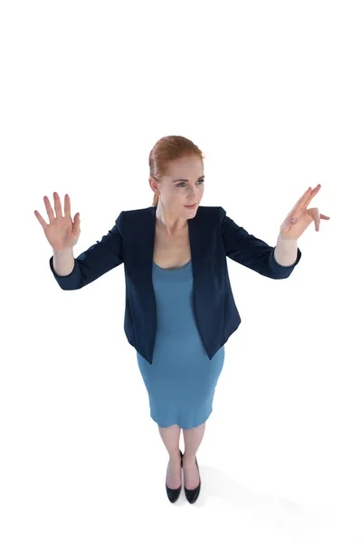 Businesswoman using imaginary interface — Stock Photo, Image