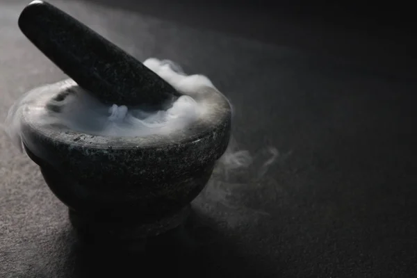 Smoke in pestle and mortar — Stock Photo, Image