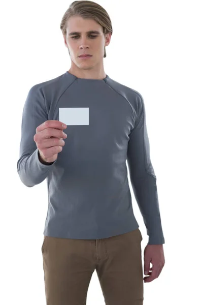 Бізнесмен читає картку на білому тлі — стокове фото