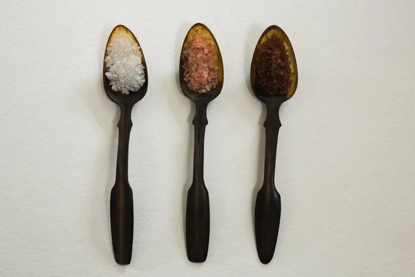 Various types of sea salt in a spoon — Stock Photo, Image