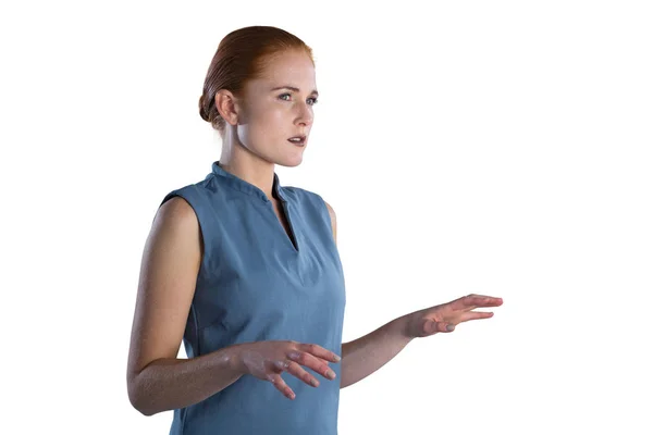 Businesswoman working on imaginary screen — Stock Photo, Image