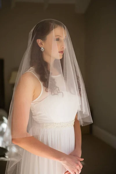 Thoughtful bride in wedding dress — Stock Photo, Image