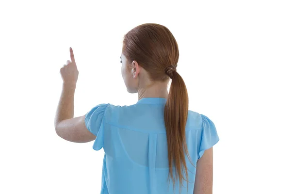 Businesswoman touching imaginary screen — Stock Photo, Image